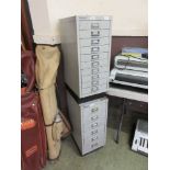 Two Bisley stationery cabinets, one having ten drawers, the other six, with contents