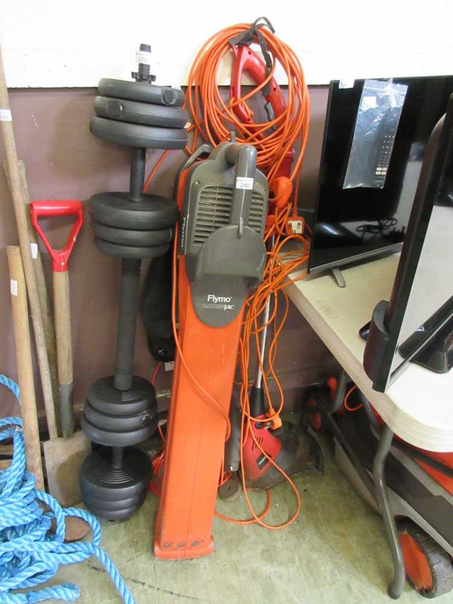 A Flymo garden vac together with two electric hedge trimmers