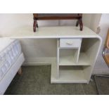 A white painted bedside cabinet