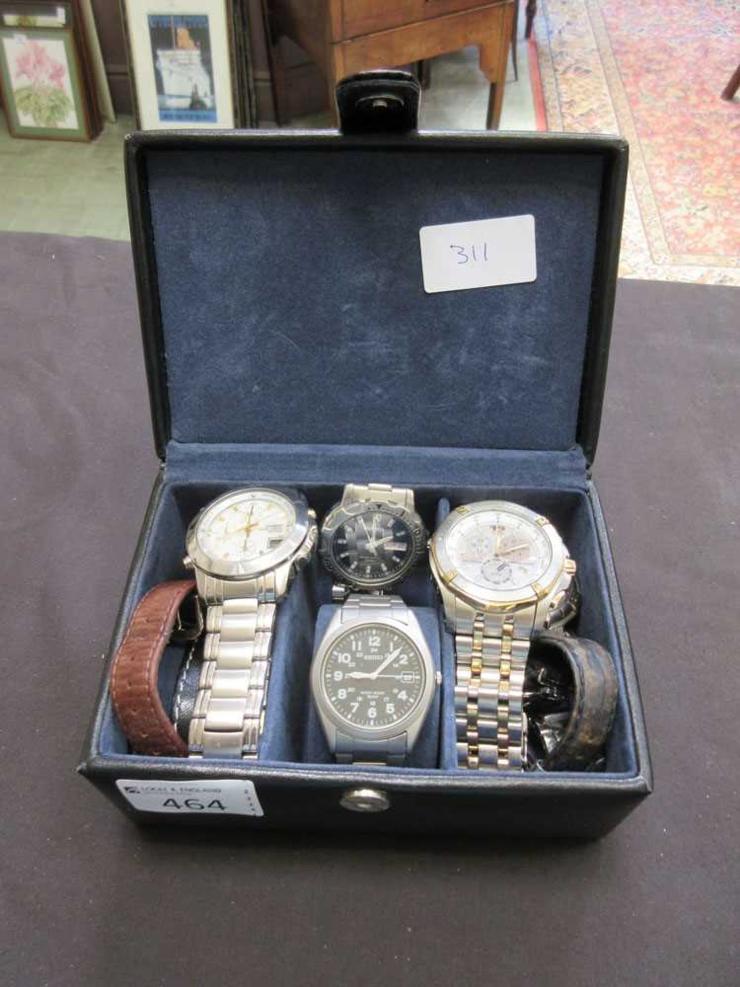 A box containing a quantity of gent's wristwatches