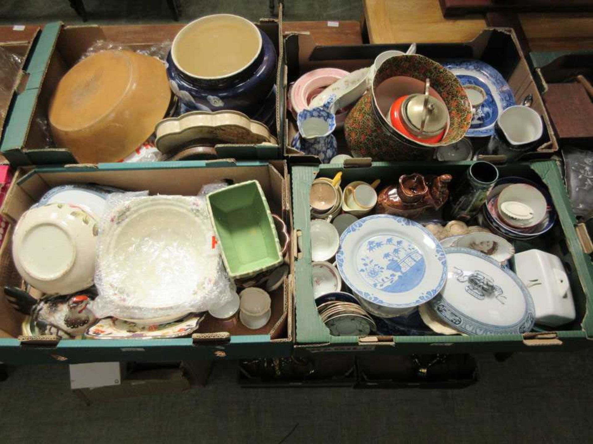 Four trays of decorative ceramic ware to include a cheese dish, planters, blue & white plates etc.
