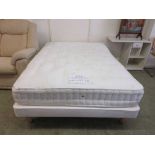 A double bedstead with a Turquoise 4000 mattress