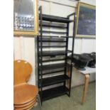 Two sets of black painted folding shelves