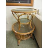 A bamboo and wicker occasional table with glass top and under tier along with one other