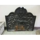 A reproduction cast iron fire back with lion design
