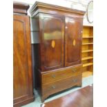 A 20th century mahogany banded and marquetry linen press, the two doors enclosing slides and open