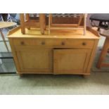A pine side cabinet, the galleried top over two drawers and two cupboard doorsDimensions: H,