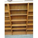 A teak open bookcase with adjustable shelving