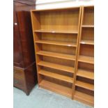 A teak open bookcase with adjustable shelving