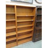 A teak open bookcase with adjustable shelving