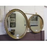 Two ornate gilt framed bevel glass mirrors