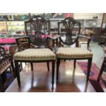 A pair of early 20th century 18th century style child's chairs, the shield back with wheatsheaf