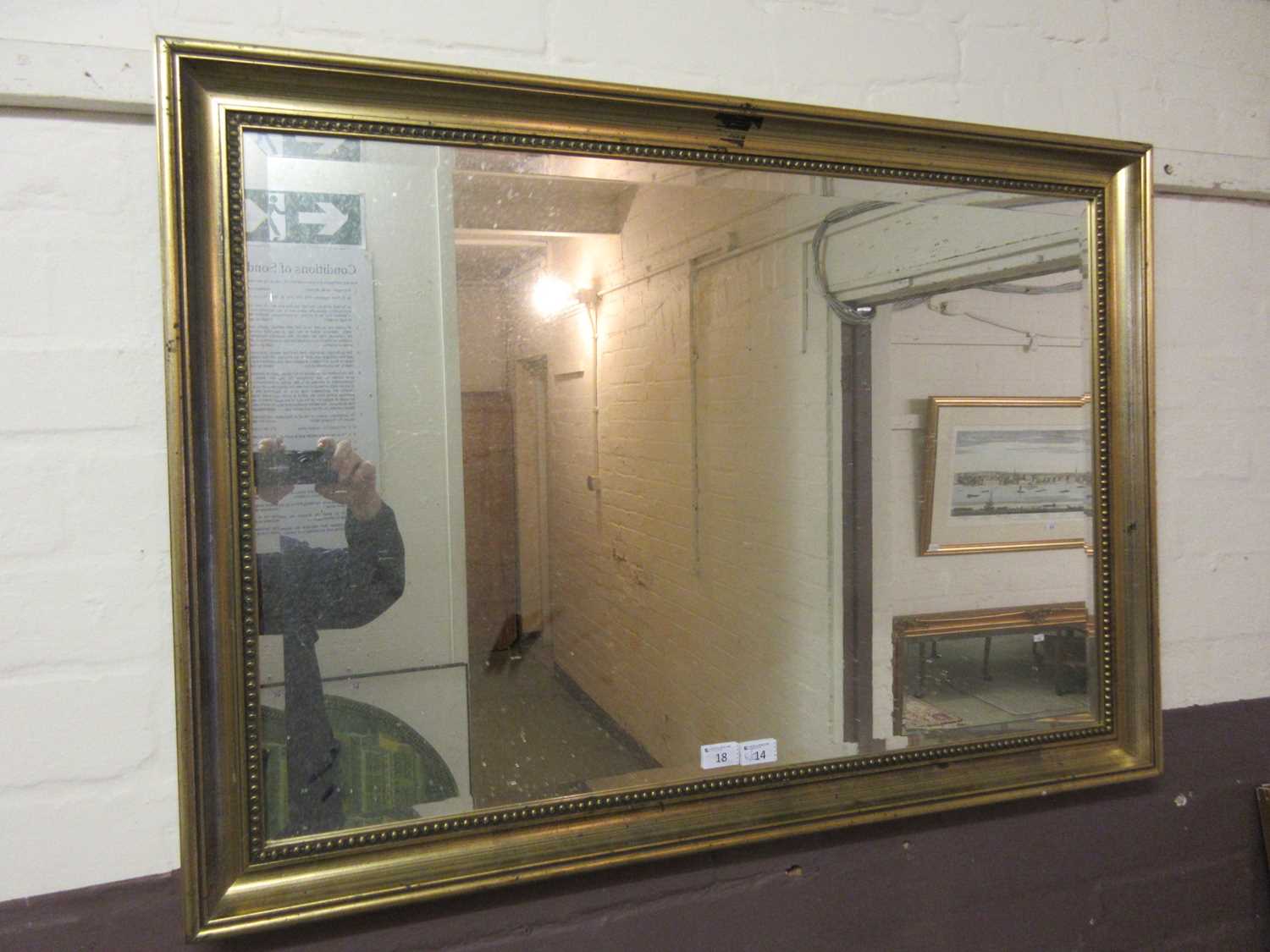 A gilt framed rectangular bevel glass mirror