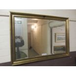 A gilt framed rectangular bevel glass mirror