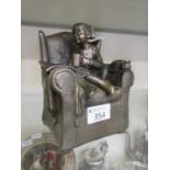 A bronzed resin model of seated child by Genesis Fine Art