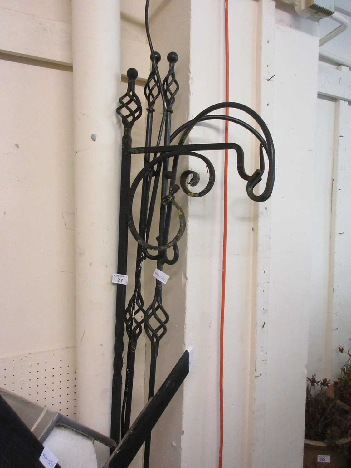 Three black metalwork free standing garden hooks