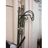 Three black metalwork free standing garden hooks