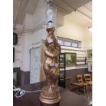 A modern moulded gilt table lamp with putto column design