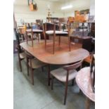 A mid-20th century Danish teak extending dining table along with a set of six (Four plus two)