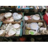 Four trays of ceramic items to include plates, cups, teapots, etc