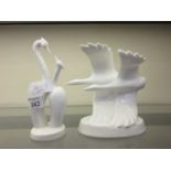 Two white ceramic figurines of birds, one Royal Doulton, the other Coalport