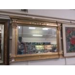 A neo-classical gilt framed bevel glass mirror