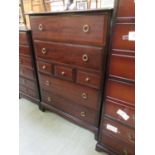 A Stag Minstrel chest of drawers, two long over three short over two long drawers