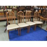 A set of four modern beech framed kitchen chairs