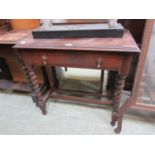 An early 20th century oak single drawer side table on barley twist legs