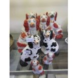 Four pairs of Staffordshire hearth dogsBlack and white dogs: Crazing throughout, Small cracks to