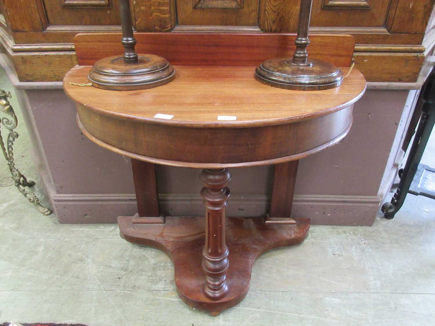 A 19th century mahogany demi-lune side table