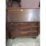 An early 20th century oak bureau, the fall front over three long drawers on bracket feet