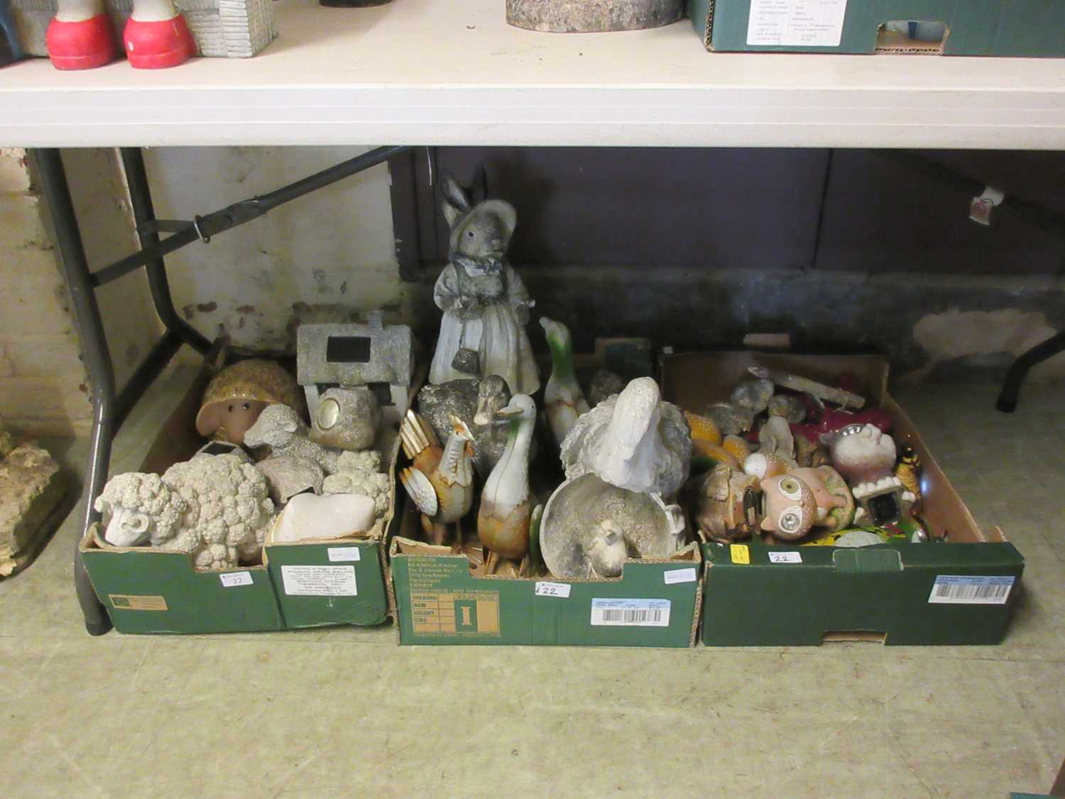 Three trays of garden ornaments to include moulded, metalwork, sheep, etc