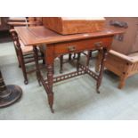 An early 20th century walnut writing table, the tooled brown leather inset over single drawer and