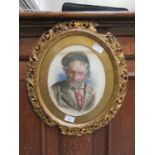 An ornate gilt framed oval watercolour of elderly gentleman signed bottom right