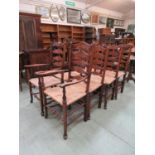 A set of eight (Six plus two) reproduction ash ladder back chairs with sea grass seats