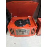 A vintage style stereo comprising of turntable, CD player, radio, tape, etc