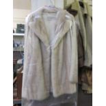 A Dominion Furs light fur jacket