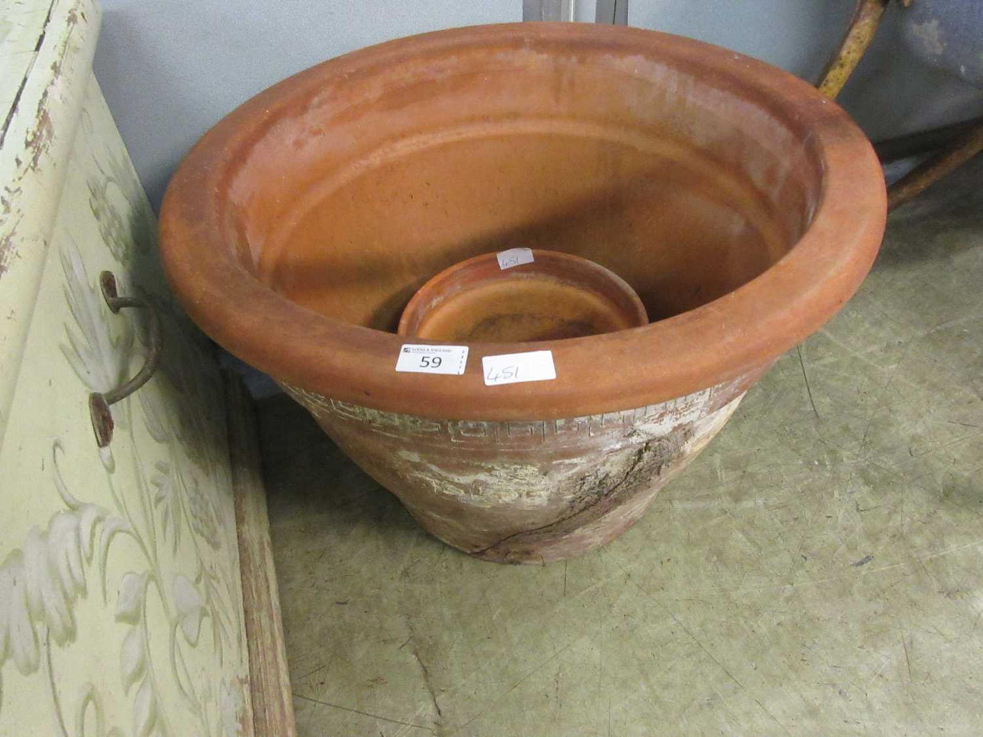 A large terracotta pot (A/F) along with one other
