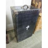 An early 20th century metal and brass mounted travelling trunk