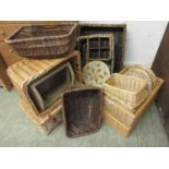 A large quantity of wicker baskets to include picnic hamper, bottle holder, etc