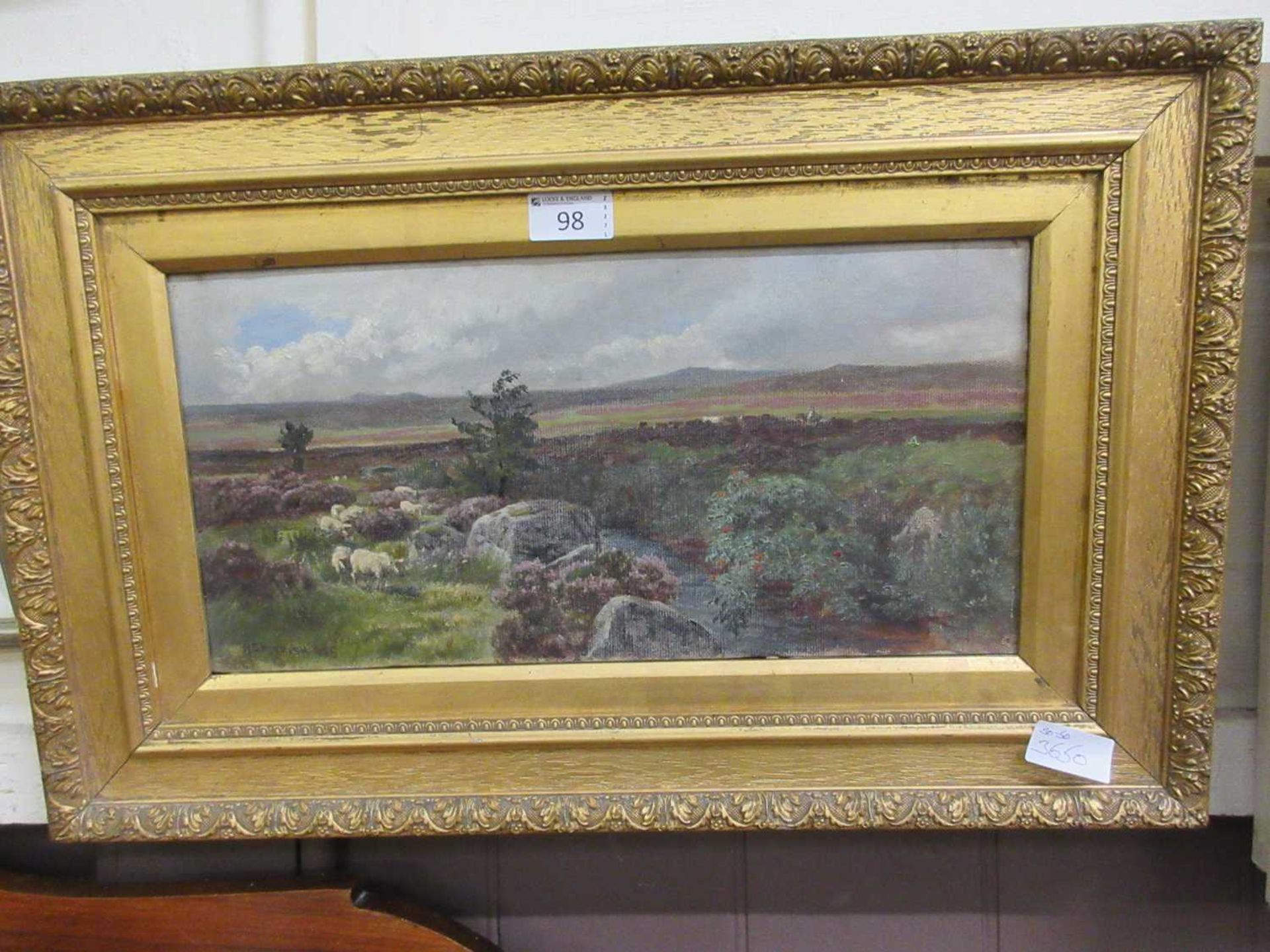 A gilt framed oil on canvas of sheep in Heathland signed bottom left