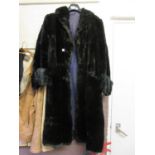 A faux fur lady's black coat