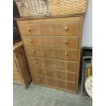 A mid-20th century oak veneered chest of six long drawers