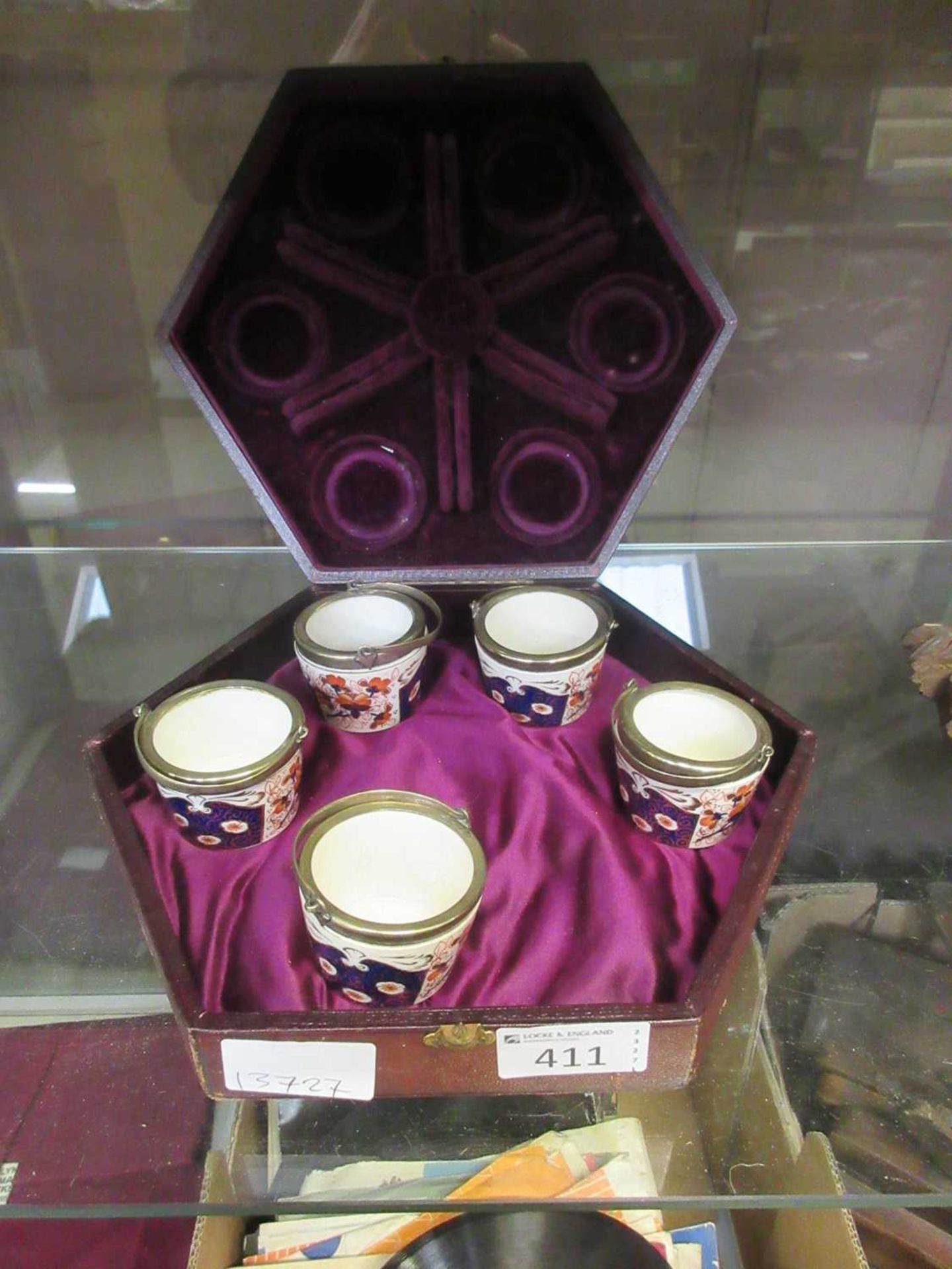 A cased set of five (one missing) ceramic egg cups