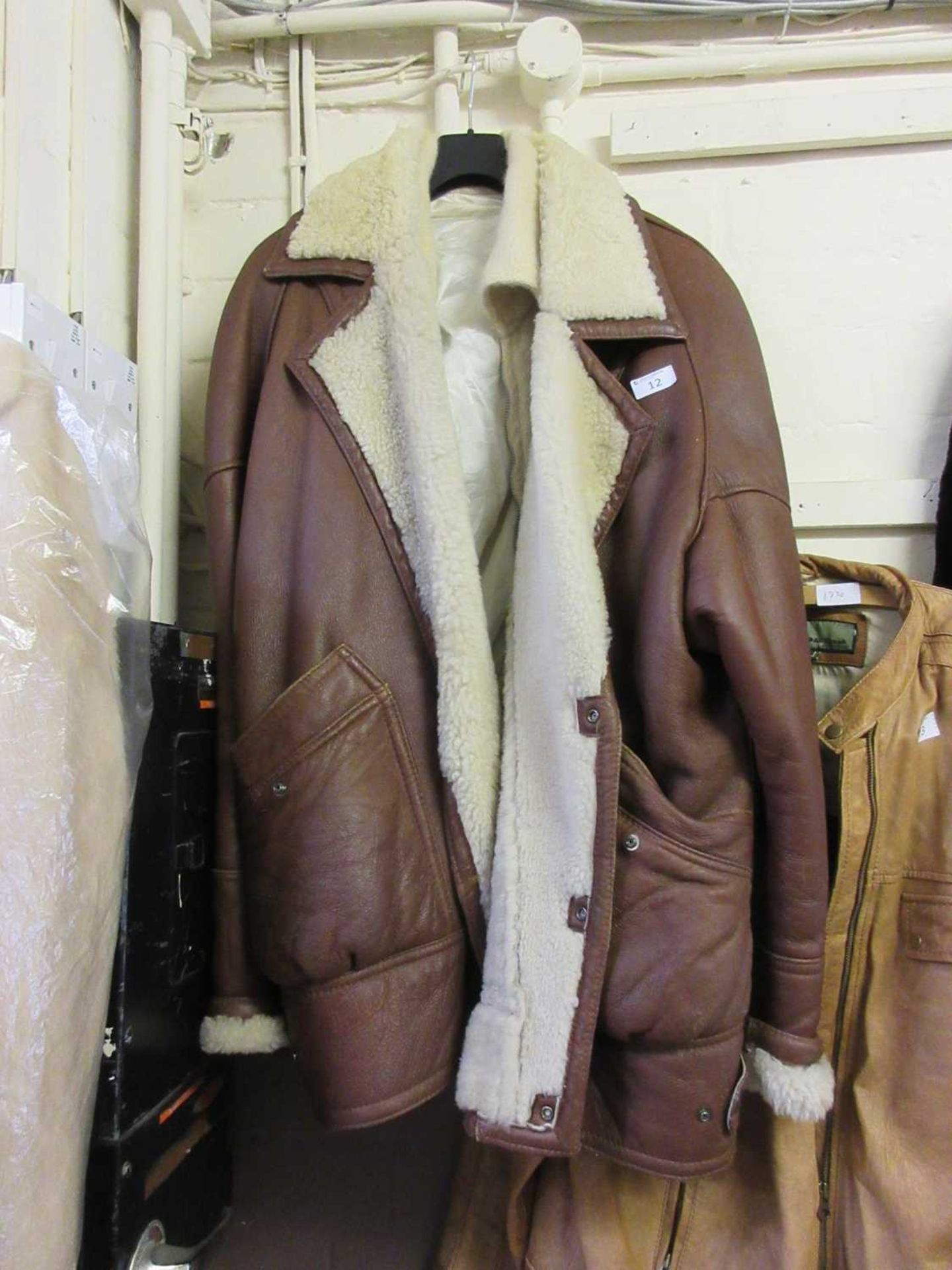 A First Cover real sheepskin jacket along with a knitted jacket