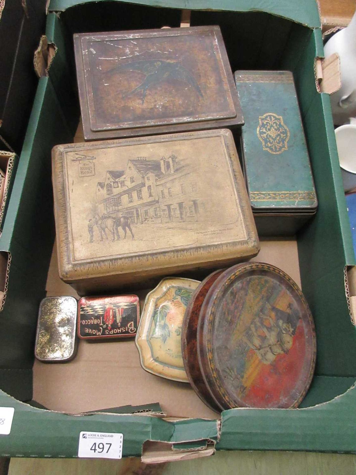 A tray of old tins