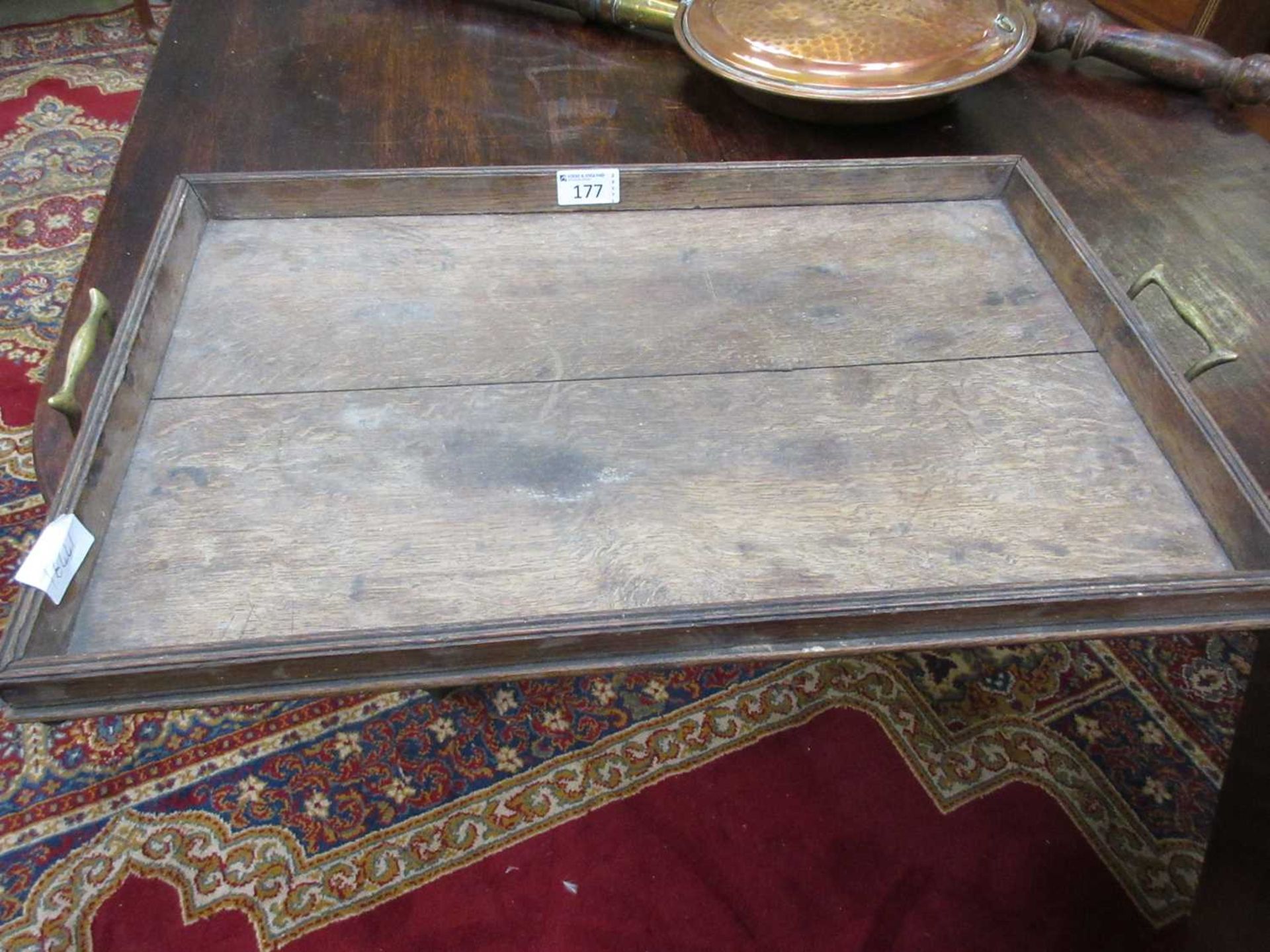 An early 20th century oak twin handled tray
