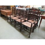 A set of eight (Six plus two) reproduction ash ladder back dining chairs with rush seat