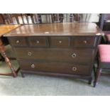 A Stag Minstrel chest of four short over two long drawers